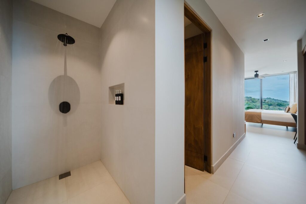 A fluid transition between bedroom and bath, defined by calm tones and understated design.