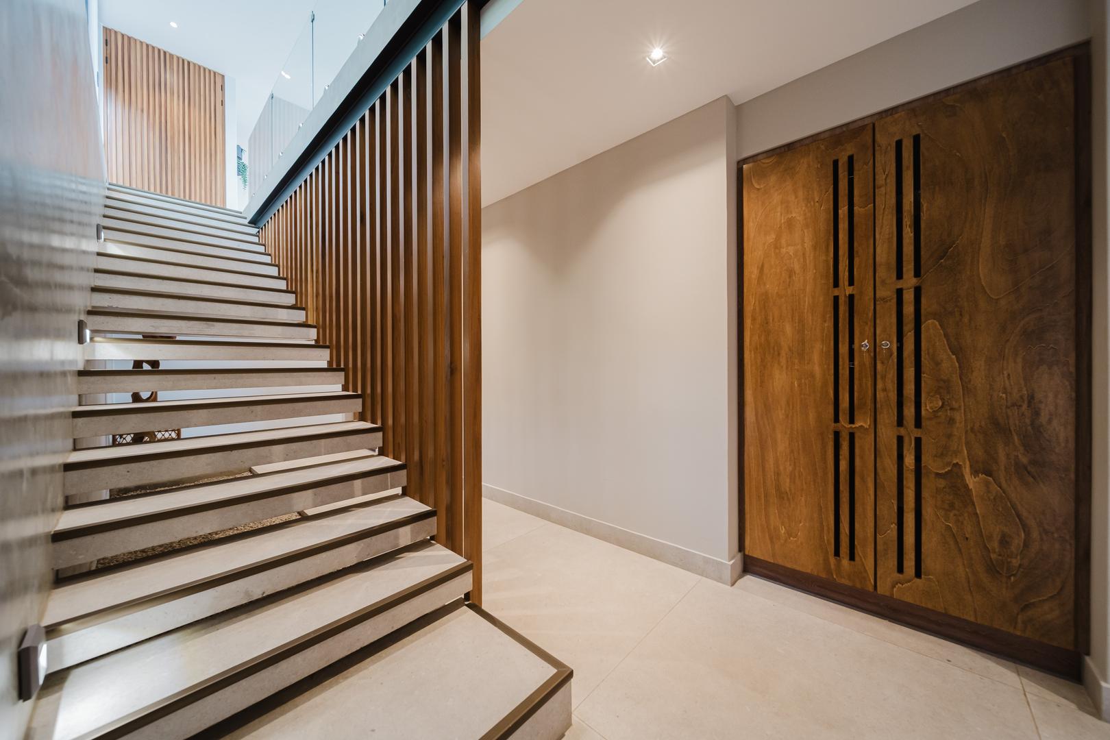 Modern staircase with wood accents and minimalist design in Manuel Antonio Costa Rica