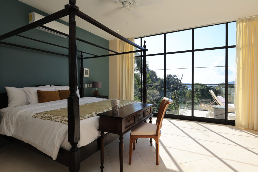 Supreme elegance is defined by magnificent, refined furniture. Floor-to-ceiling glass doors provide unparalleled ocean views of Manuel Antonio.