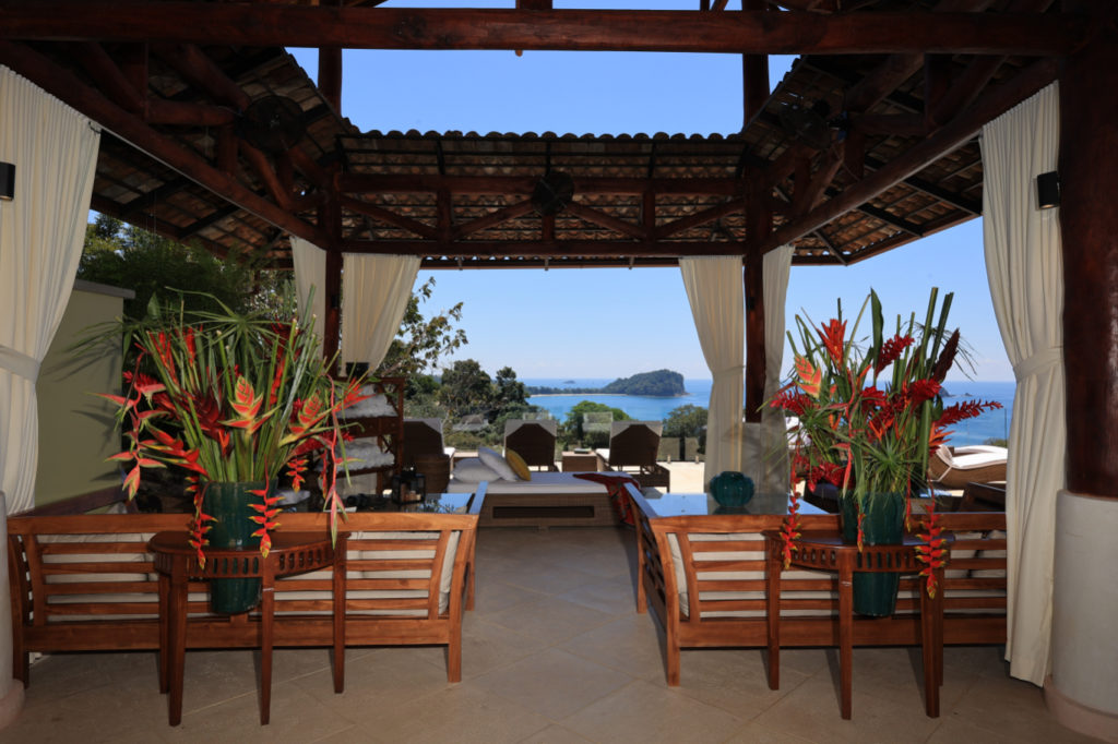 A vast outdoor seating and lounge area, providing breathtaking vistas of the ocean.
