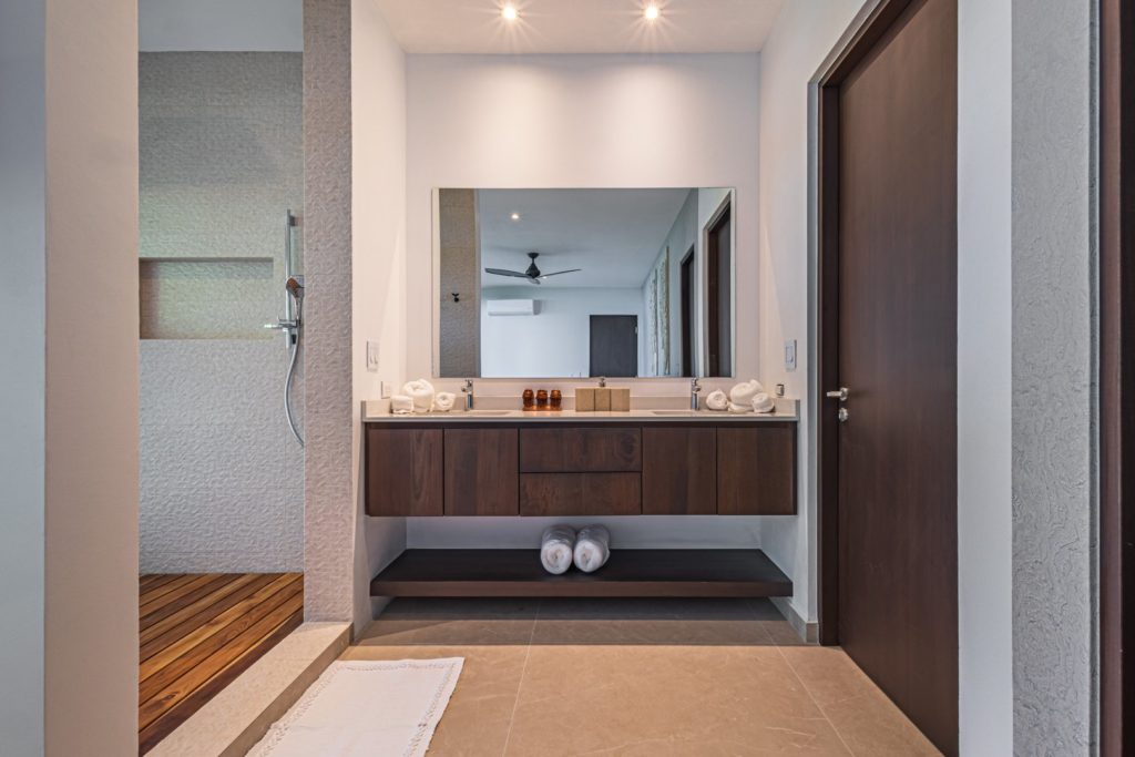 Floating cabinets in the bathrooms add to the incredible modern design.
