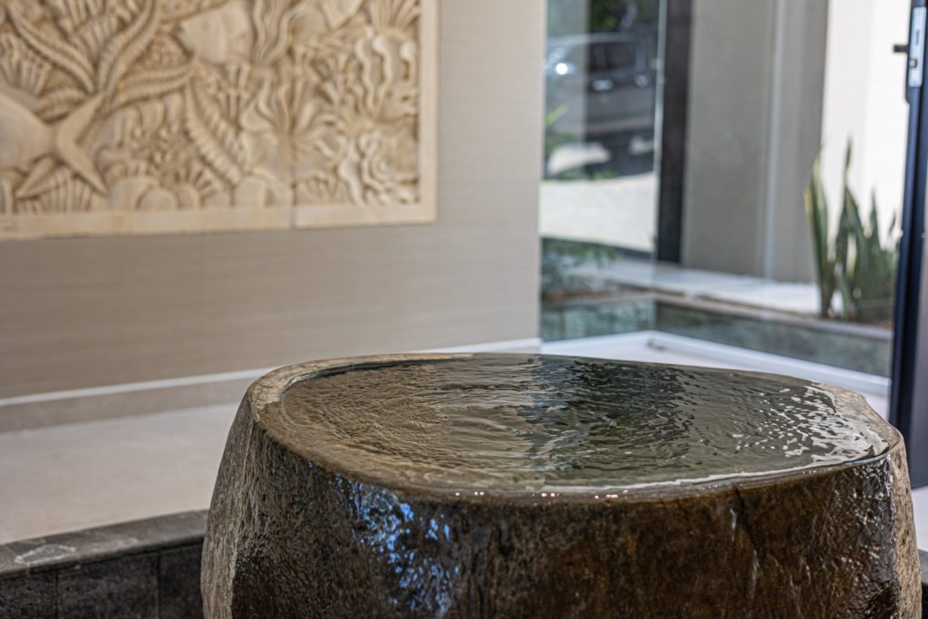 The attention to detail in this luxury home is outstanding, this natural stone water feature is a great example.