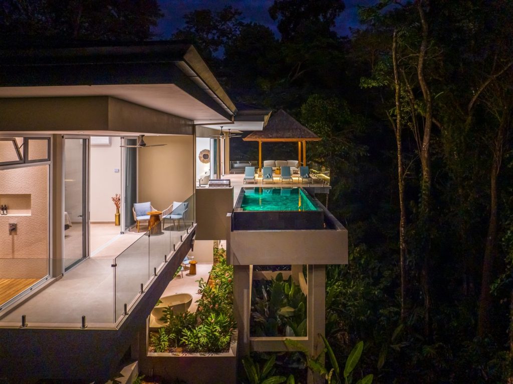 The dramatic rainforest setting of this breathtaking villa is even more amazing at night.