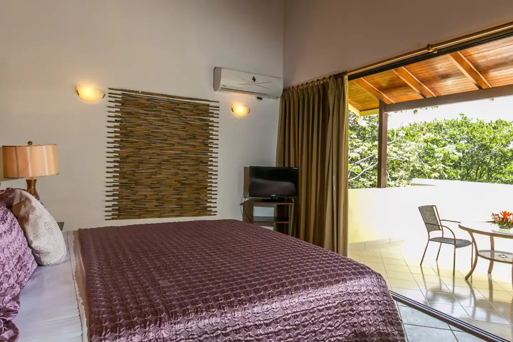 The king master bedroom boasts a balcony and an ensuite bathroom for added convenience and comfort. 