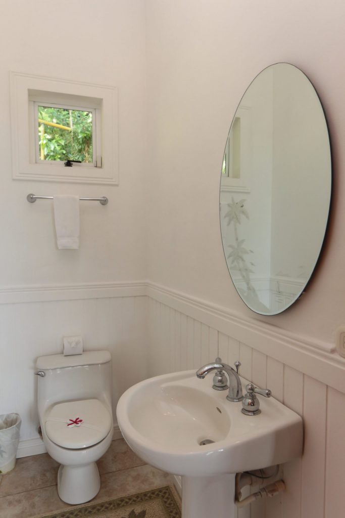 Conveniently located, the powder room offers quick access and practicality for guests.