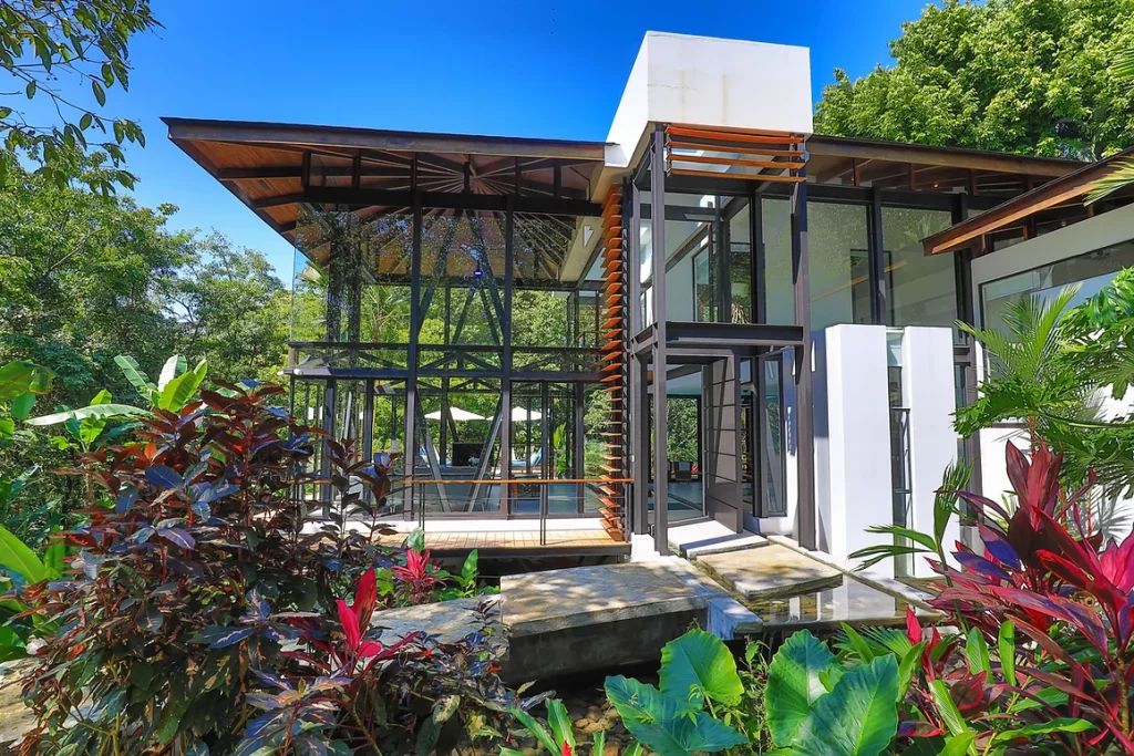This contemporary vacation villa is embraced by the stunning beauty of Manuel Antonio's wildlife, forests, and beaches.