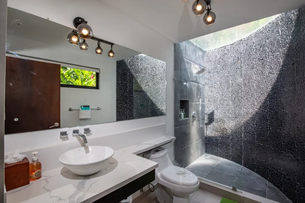 A beautifully designed modern bathroom with exquisite materials and abundant natural light.
