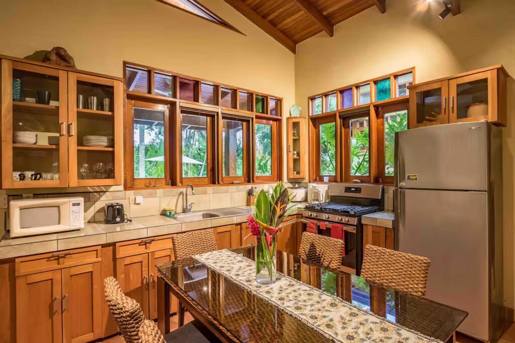 This kitchen is one area to eat with family at the dining table for six guests.