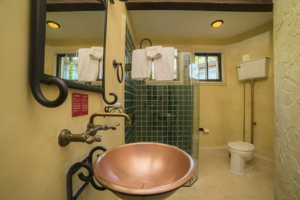 This bathroom's unique design gives it a warm, rustic feel.