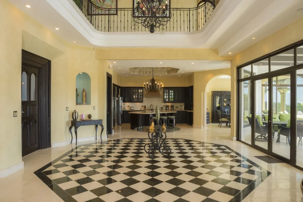A striking entryway with an upper gallery gives this property an unforgettable first impression.