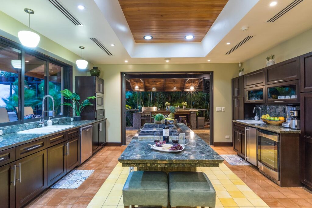 Open kitchen and outdoor bb-area-with-natural-stone-and-wood-design