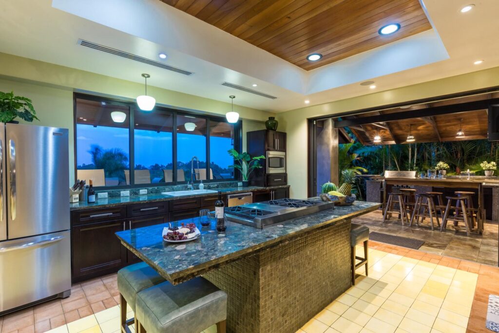 Chef’s kitchen that opens to an outdoor barbecue area.