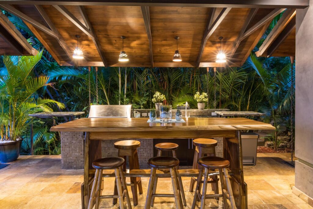 Evening lounge under soft lights surrounded by jungle and tropical breeze.