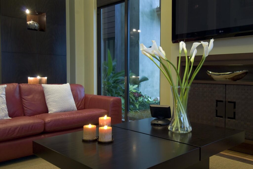 Soft textures, natural tones, and candlelight create a peaceful modern interior.