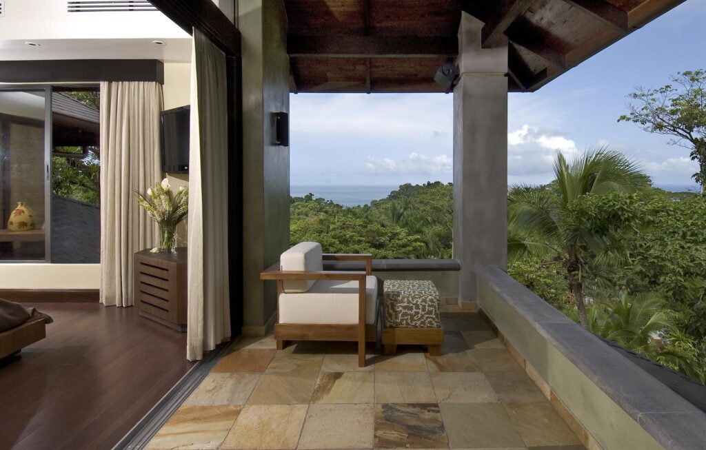 Private terrace overlooking endless rainforest and ocean views.