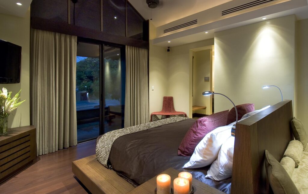 As evening falls, the room becomes a softly glowing retreat.