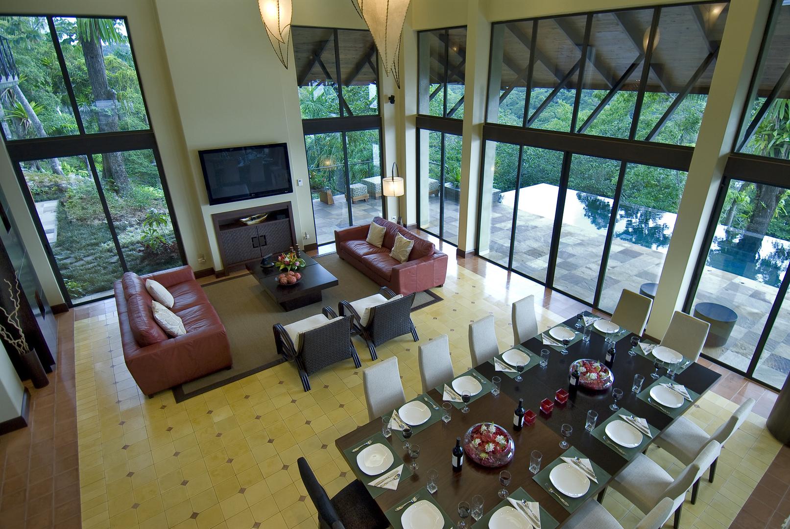 floor-to-ceiling-glass-overlooking-the-infinity-pool-and-rainforest-canopy
