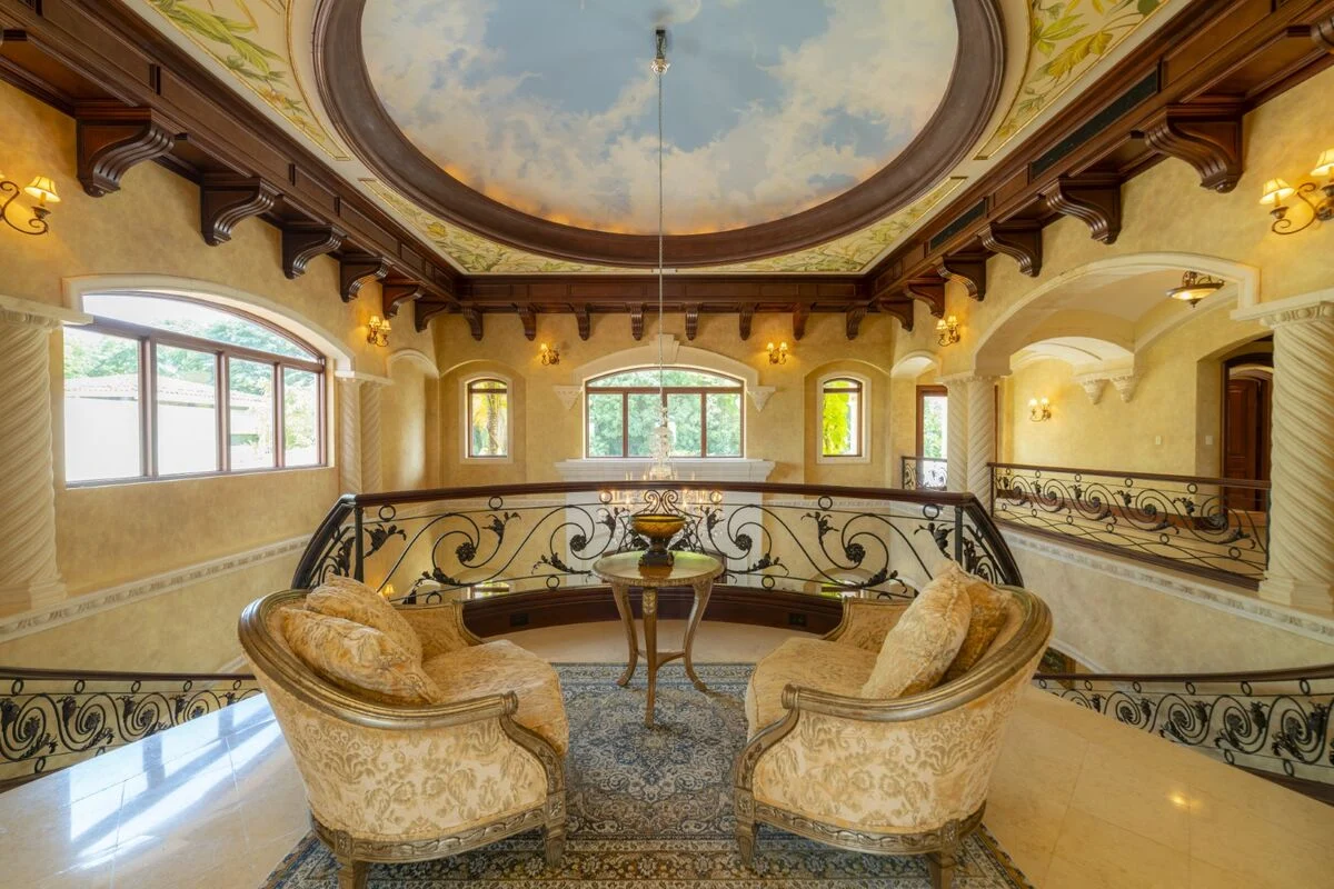 luxury villa mezzanine los suenos interior wrought iron railings coffered ceiling costa rica