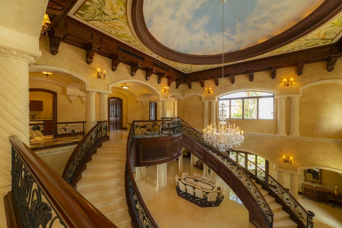 luxury villa interior mezzanine staircase chandelier los suenos high ceiling elegant design