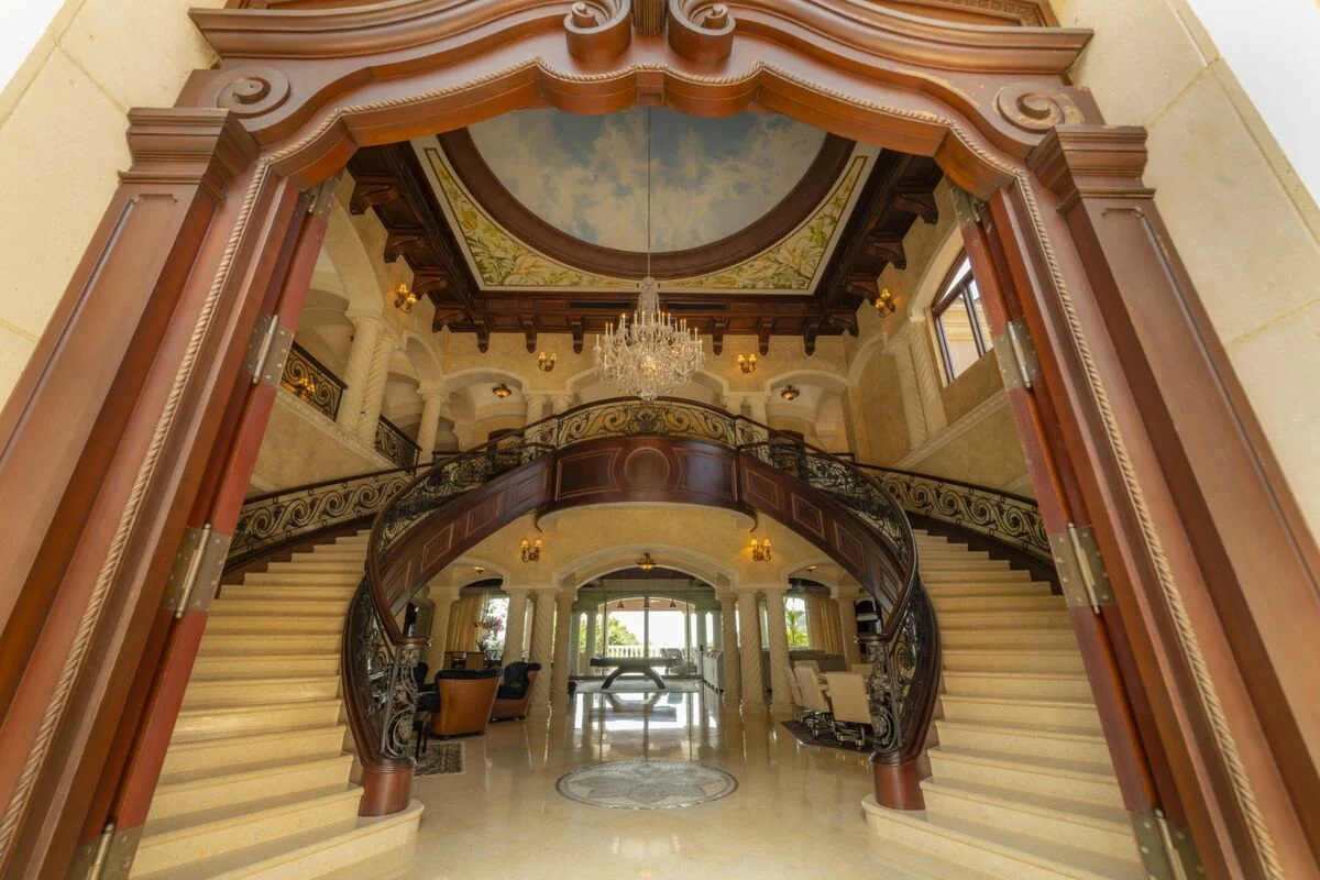 luxury villa grand staircase los suenos interior chandelier architectural details costa rica