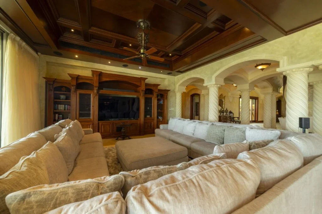 A spacious living area designed for gathering, with comfortable seating and a relaxed, inviting atmosphere.