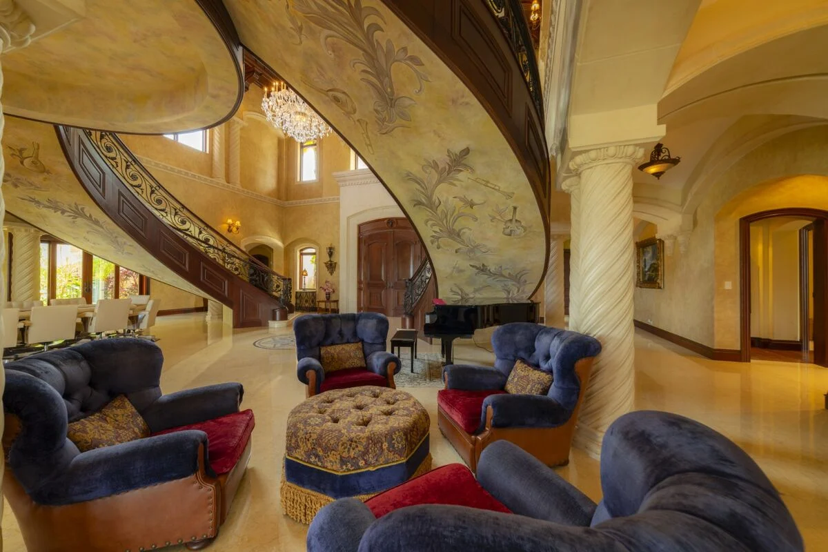 luxury villa lounge seating los suenos grand staircase piano interior elegant space