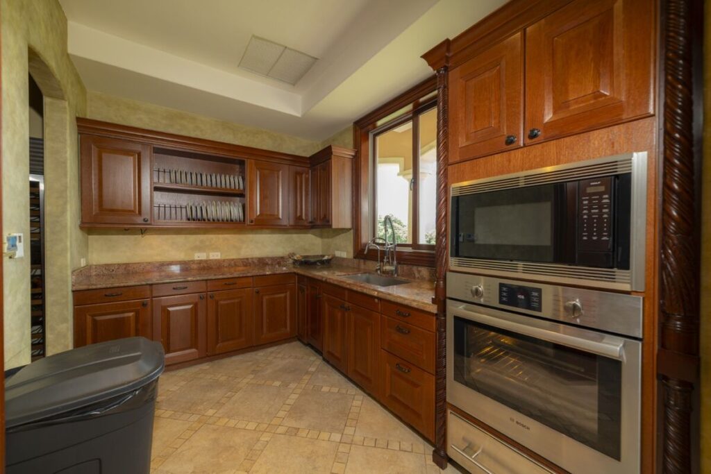 An additional kitchen and prep area designed to support seamless service, offering ample storage, workspace, and convenience for extended stays or private chef experiences.
