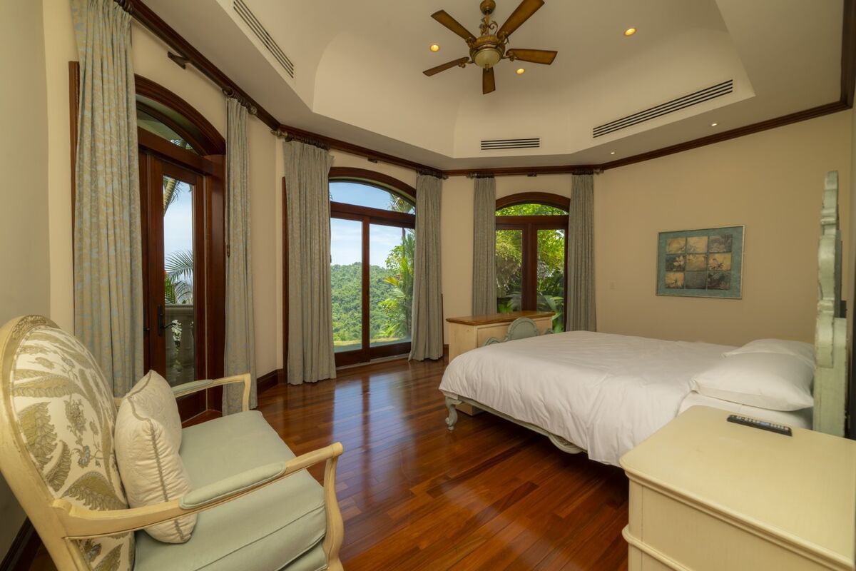 luxury villa bedroom large windows terrace view los suenos costa rica