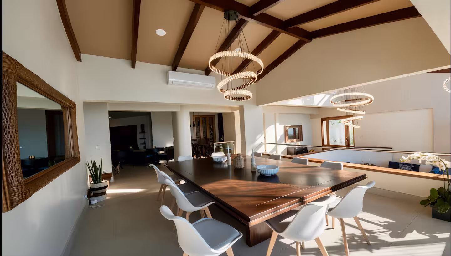 Open-concept dining room with vaulted ceilings in a luxury beachfront vacation home in Costa Rica