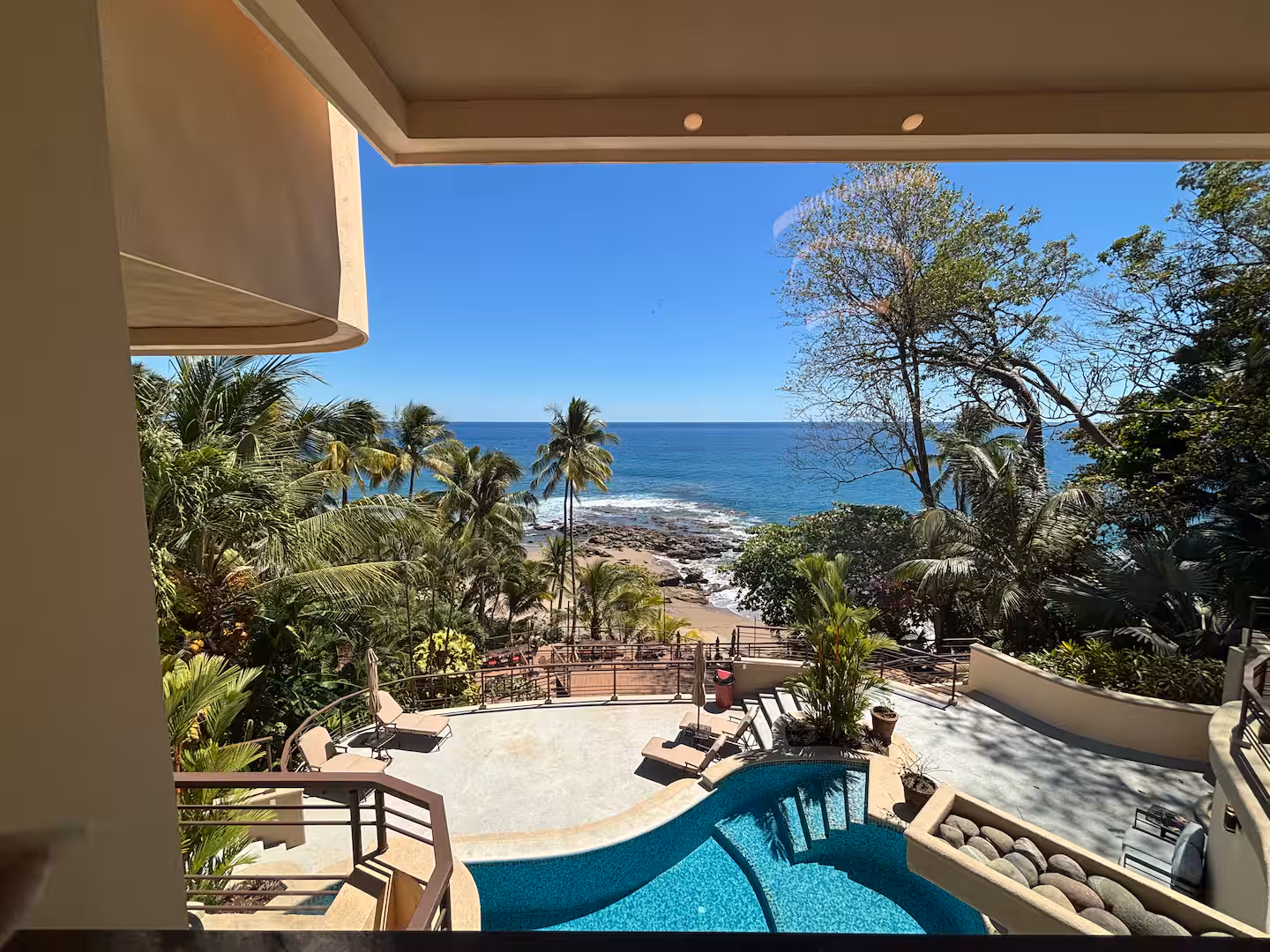 Ocean-view swimming pool overlooking a beachfront deck and the Pacific Ocean in Costa Rica