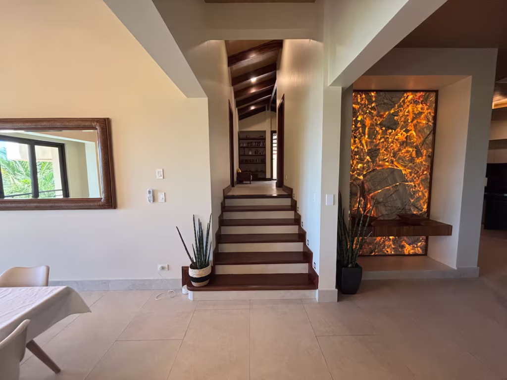 A bright split-level interior with warm wood accents, soaring ceilings, and architectural details that create a welcoming sense of space.