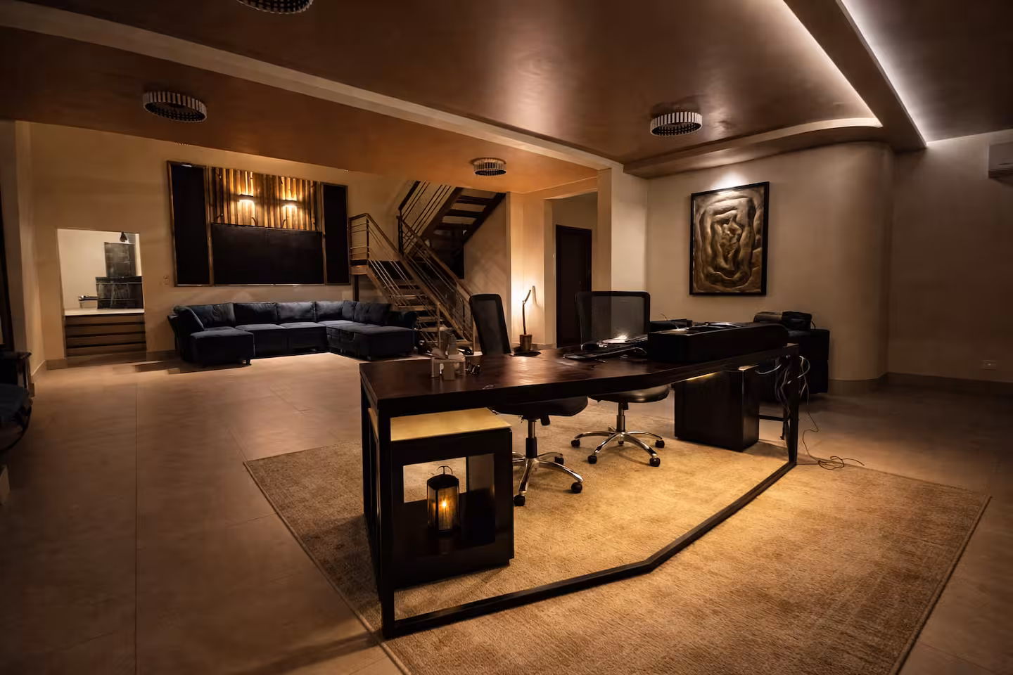 Private office and media lounge with workspace and large television in a Costa Rica luxury villa