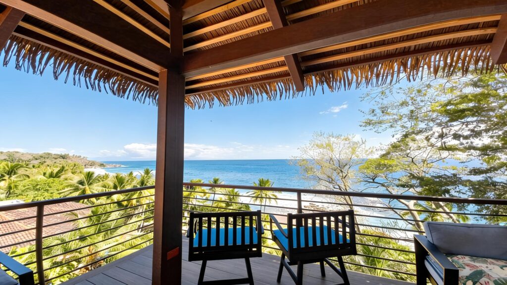 Covered outdoor terrace with panoramic Pacific Ocean views at a luxury beachfront villa in Costa Rica