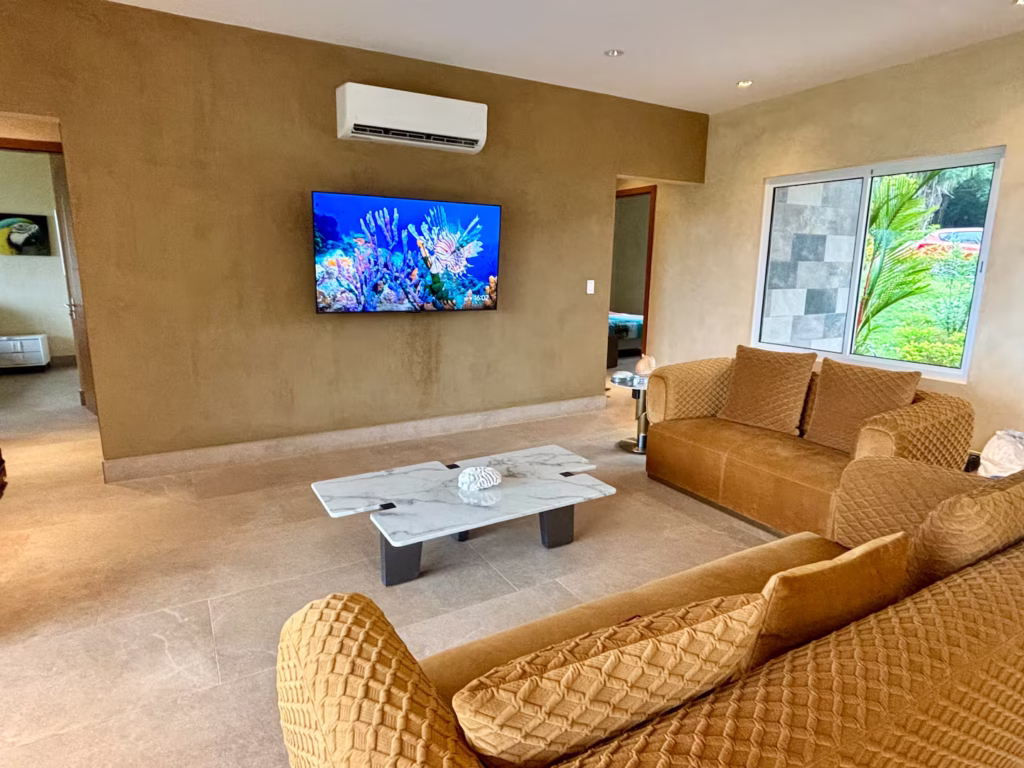 Comfortable sofas and a spacious entertainment area provide the perfect place for families to unwind after a day exploring Costa Rica's beaches and wildlife.