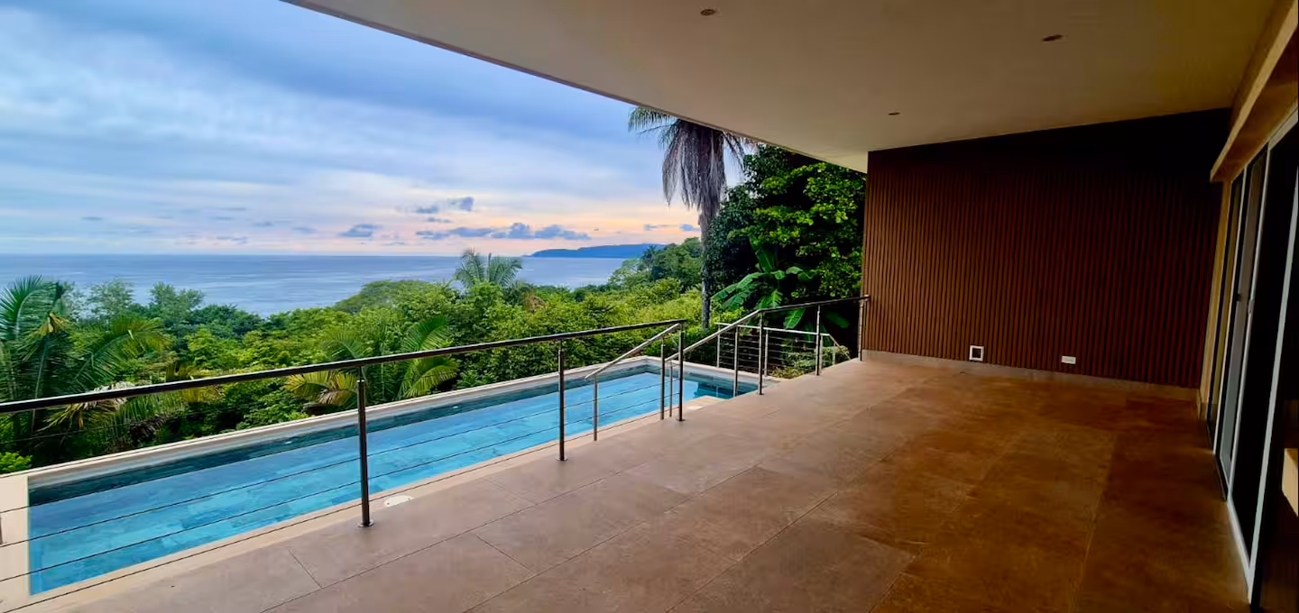 Covered ocean view terrace with private pool at a Costa Rica family vacation villa